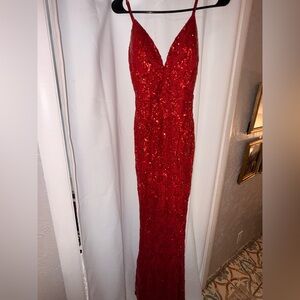 Long red sparkly dress with slit on one leg